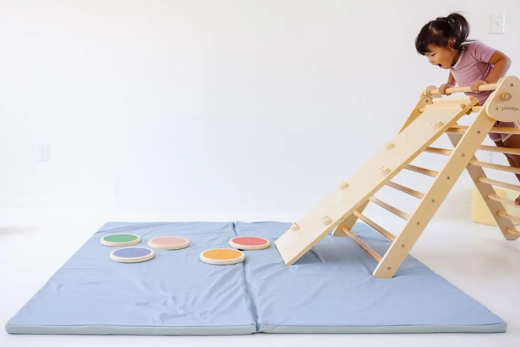 toki mat with montessori pikler triangle