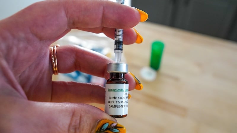 close up of vial with syringe