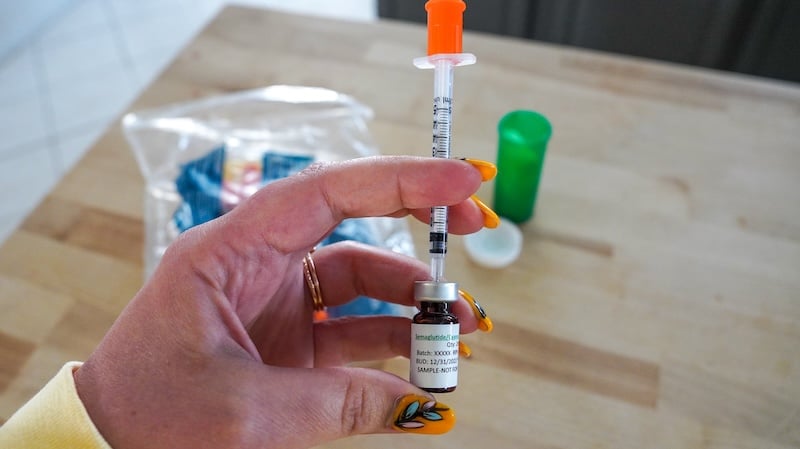 filling up semaglutide syringe with vial