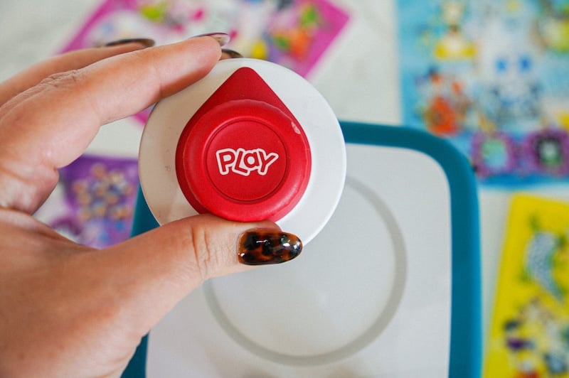 holding toniebox 2 play button